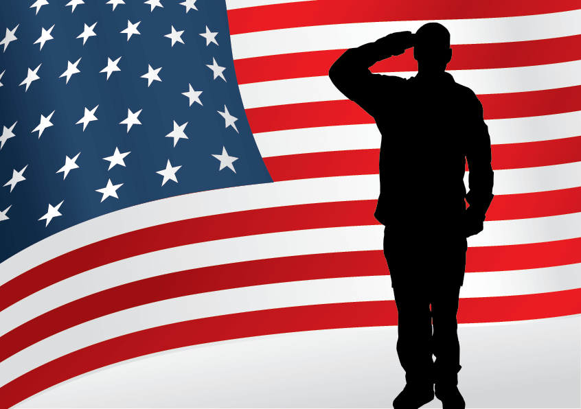 Man saluting silhouetted against an American flag